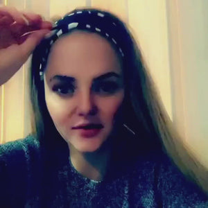 Video of Emily showing different ways to wear the Zebra EDS awareness headband