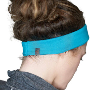 Back view of women wearing aqua bamboo yoga headwrap