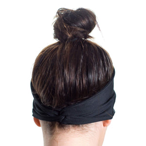 Back view Women wearing a black reversible sports headband highlight twist