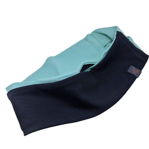 Close up of black-aqua rev7ersible winter sports headband
