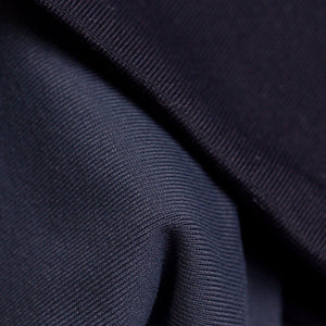 close up of fabric used to make blue-grey reversible winter sports headband