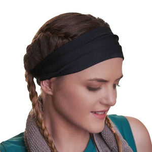 Women wearing a black reversible sports sweatband with towel draped over her neck