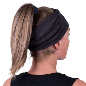 Side view of women wearing black moisture-wicking sports headband