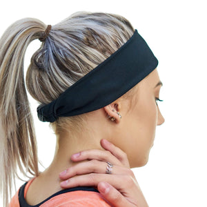 Women wearing black tie behind exercise headband