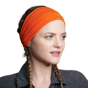 Women wearing flame coloured bamboo headband looking sidewise