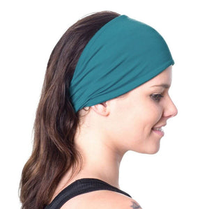 Side view of women wearing wide teal bamboo headwrap