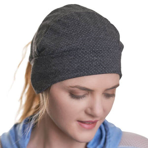 Women wearing black merino wool ponytail friendly beanie
