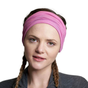 Women looking into the camera wearing pink bamboo sports headband