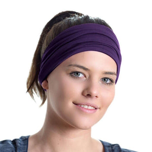 Women looking into the camera wearing purple bamboo head wrap