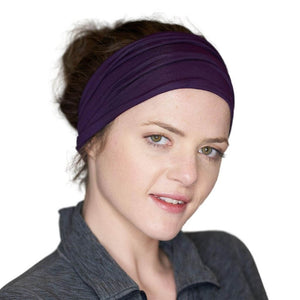 Women looking at the camera wearing yoga exercise bamboo headband