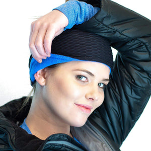 Women wearing recycled Polartec ear warmer showing blue lined fleece