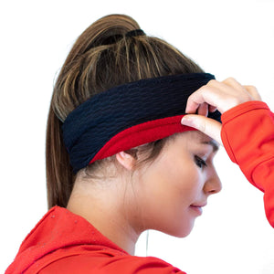Women wearing recycled Polartec ear warmer showing red lined fleece