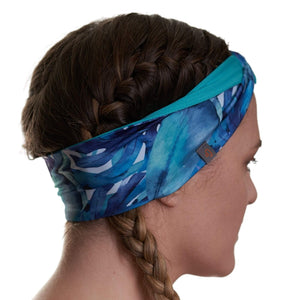 Side view of women wearing reversible recycled patterned exercise headband