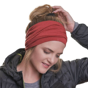 Women looking down while wearing ZQ merino wool ponytail friendly beanie