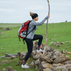 Women hiking wearing black merino wool neck warmer