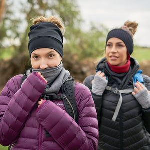 Two women hiking wearing black & red Polartec fleecy neck warmer