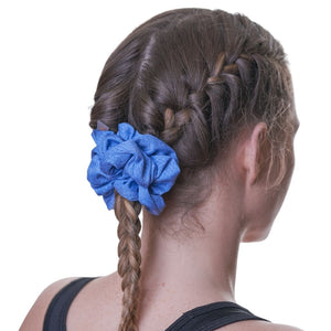back view of women wearing blue sports scrunchie with braided hair