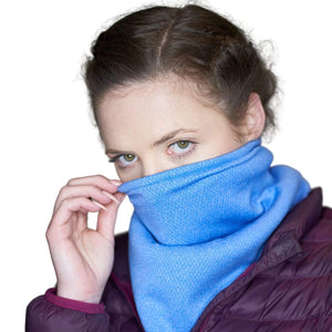 Women wearing french blue Polartec fleecy neck gaiter as a mask