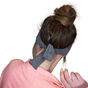 Women wearing reversible gray/black adjustable tie behind exercise headband