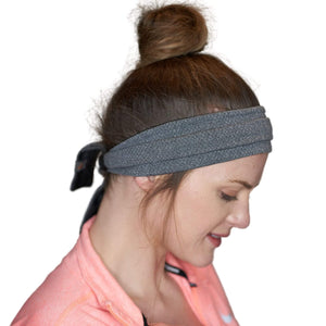 Women wearing reversible gray/black adjustable tie behind workout sweatband