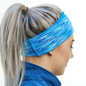 women wearing blue-aqua reversible winter sports ear warmers