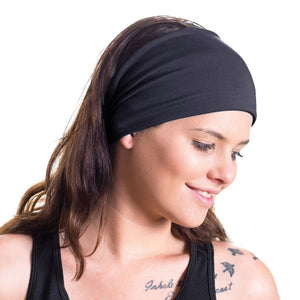 women wearing dark blue bamboo yoga head wrap