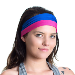 Women wearing a pink/blue reversible sports headband