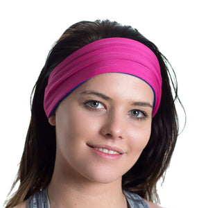 Women wearing a pink/blue reversible sports sweatband