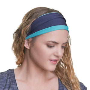 Women wearing moisture wicking reversible sports headband looking left gazing towards the ground