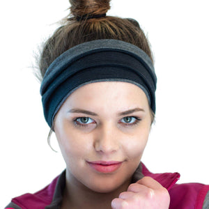 Head shot of women wearing a striped/grey merino wool reversible sports winter headband