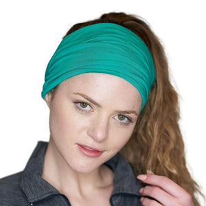 Front view of women looking into camera wearing a turquoise bamboo headwrap