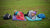 2 ladies lying on yoga mats out side turning around with hand on cheek wearing breathable workout headbands.