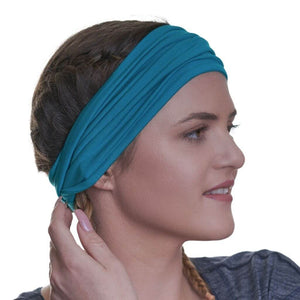 women wearing aqua bamboo yoga headband with hair in braids