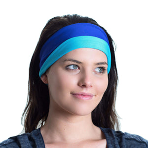 Women wearing a aqua/purple reversible sports headband