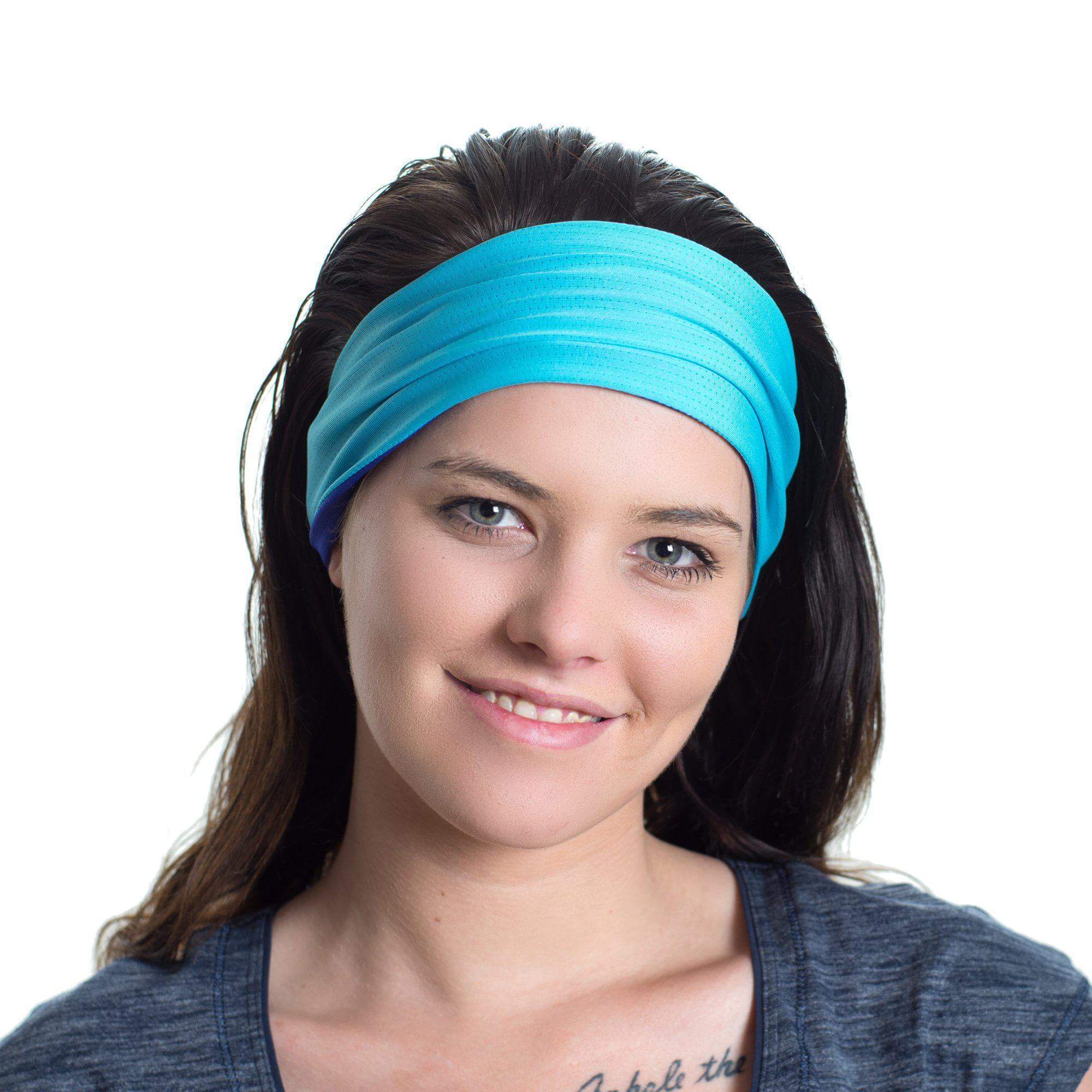 Women wearing a aqua/purple reversible sports headband