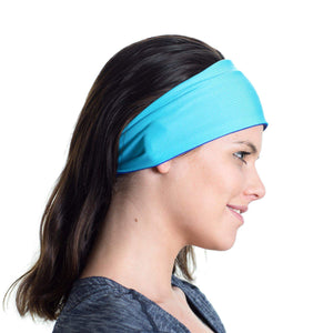 Women wearing a aqua/purple reversible workout headband