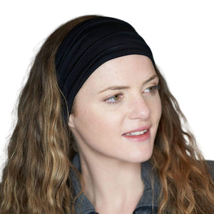 women wearing black bamboo headband looking to the right