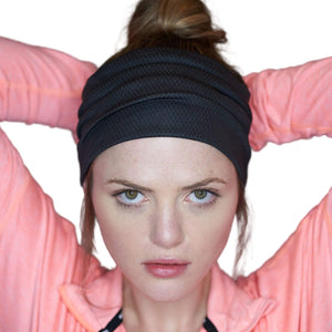 Women wearing black moisture-wicking sports headband
