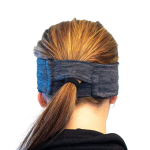 women wearing midnight-black-grey reversible winter sports headband with view of black ponytail slot
