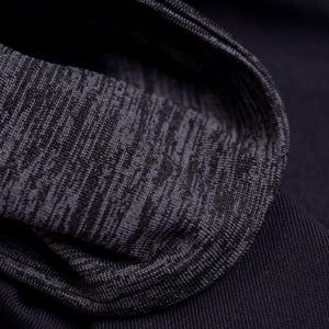 close up of fabric used to make midnight-black-grey reversible winter sports headband