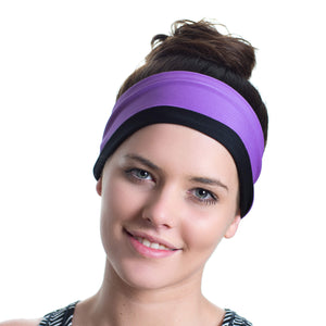 Women wearing a black/lilac reversible sports headband