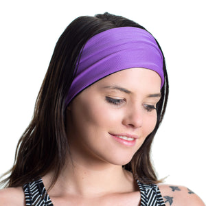 Women wearing a purple/lilac reversible sports headband