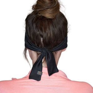 Back view of women wearing black adjustable tie behind sports headband