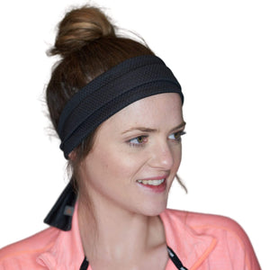 Women wearing black adjustable tie behind sports headband