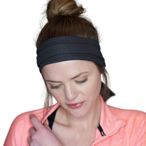 Women wearing black adjustable tie behind active headband