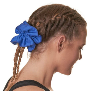 sideview of women wearing blue workout scrunchie