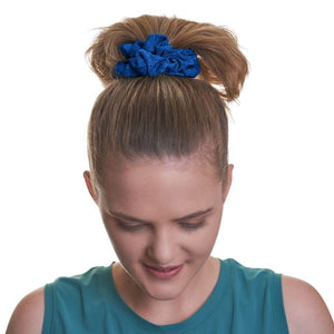 women wearing dark blue gym scrunchie in high ponytail