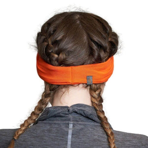 Back view of women wearing orange bamboo sports headwrap