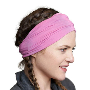 Sideview of women wearing light pink Pilates bamboo  headwrap