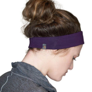 Back view of lady wearing purple bamboo yoga headband